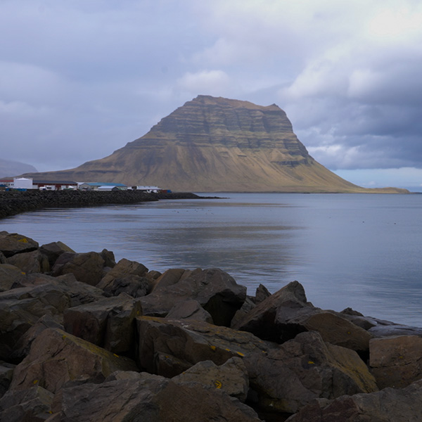 Wide view of Iceland’s rugged Snæfellsnes coastline with cliffs and ocean. Island