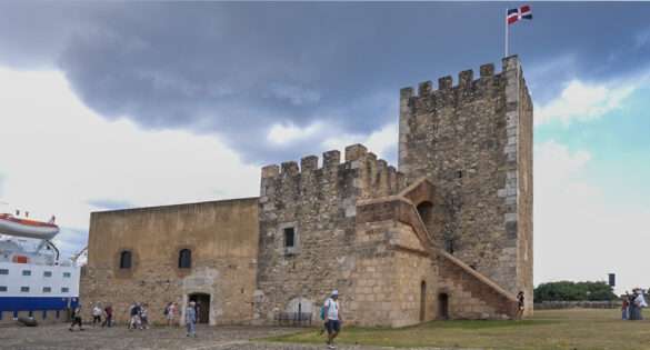 Fortaleza Ozama, the old stone fortress with the Dominican flag flying, Santo Domingo, Dominican Republic