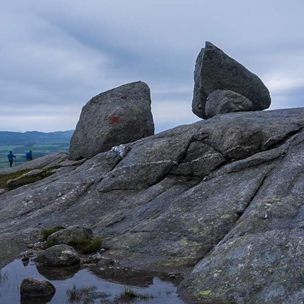 Two large boulders balanced on the rocky summit of Vettfjellet, Sandnessjøen, Norway