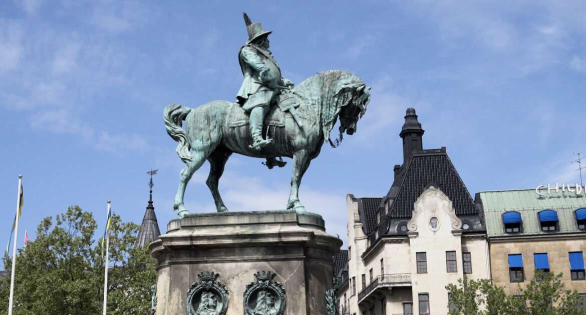 Equestrian statue of King Karl X Gustav on Stortorget square in Malmö against a summer sky