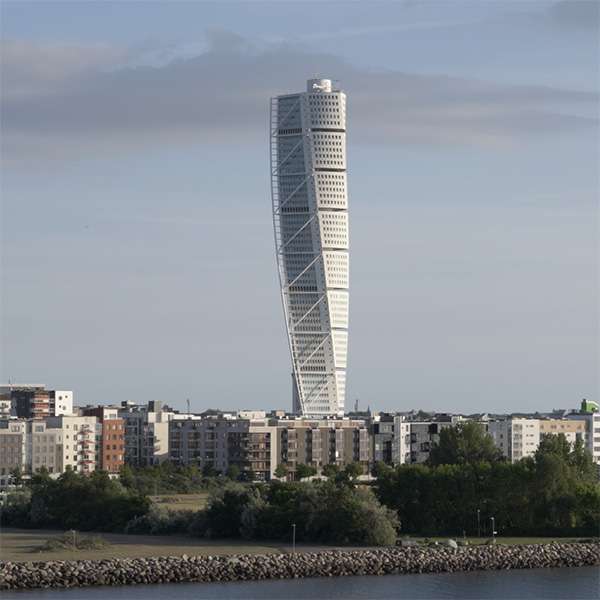 The Turning Torso tower rising above Malmö's Västra Hamnen waterfront, seen from the sea