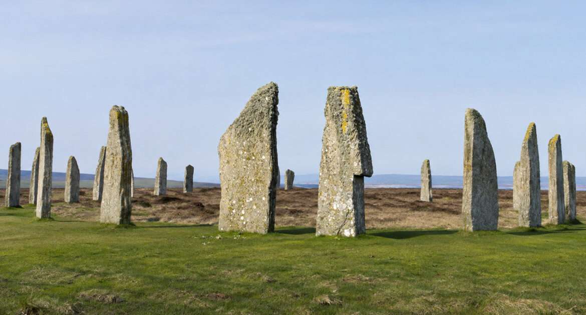 Standing stones of the Ring of Brodgar on open moorland, Orkney