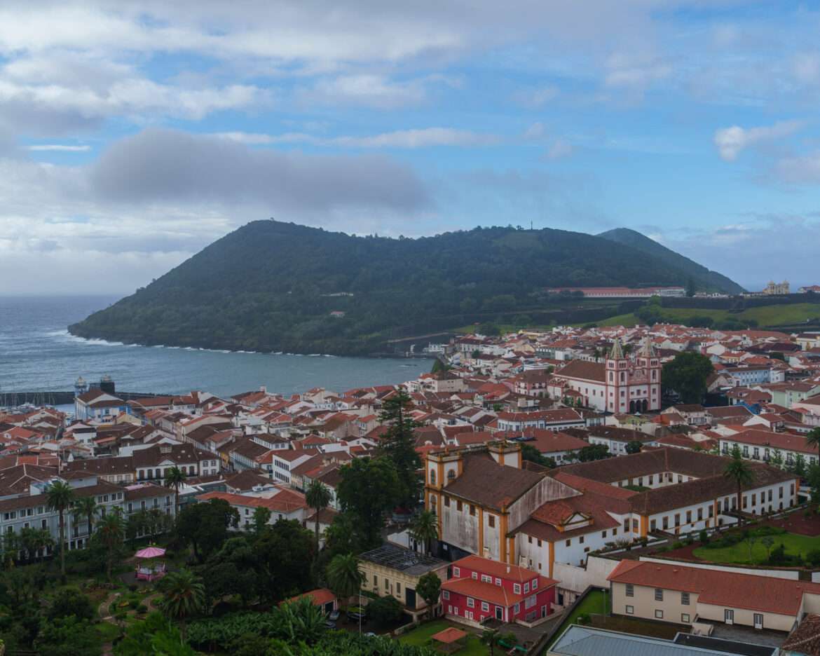 Angra do Heroísmo from above, red roofs running down to the bay and Monte Brasil