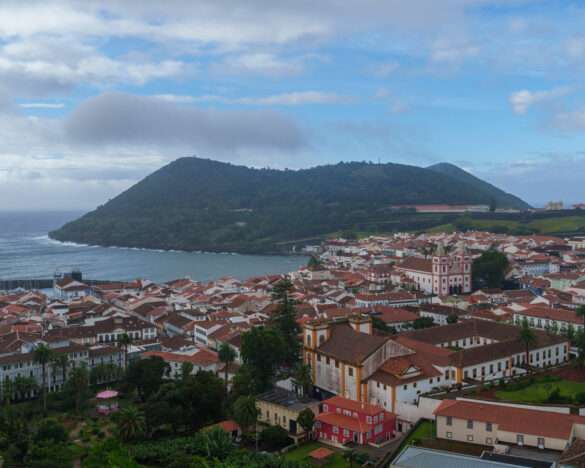 Angra do Heroísmo from above, red roofs running down to the bay and Monte Brasil