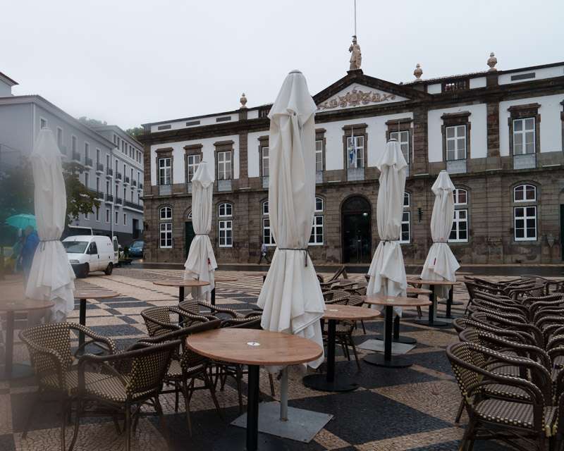 Café tables on the Praça Velha in front of the town hall of Angra do Heroísmo