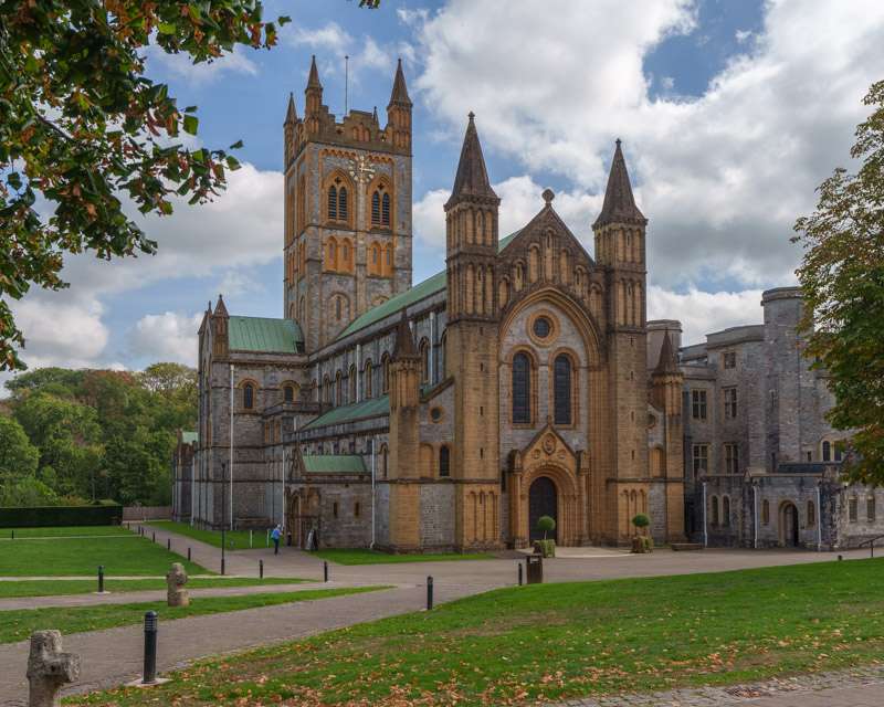 West front of Buckfast Abbey with its twin towers above the lawn