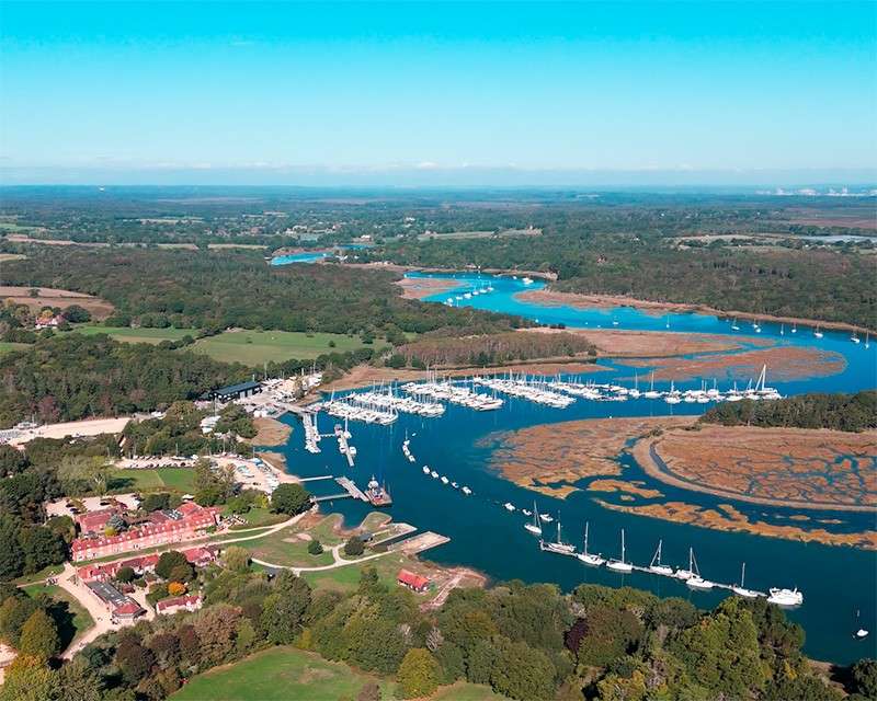 Buckler's Hard and the Beaulieu River from above, with the sea in the distance