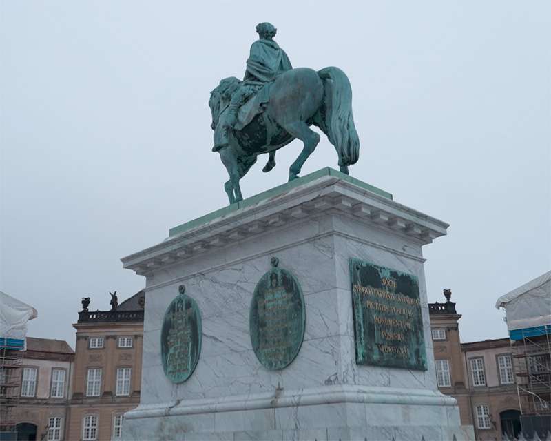 The equestrian statue of Frederik V in the centre of Amalienborg Square in haze
