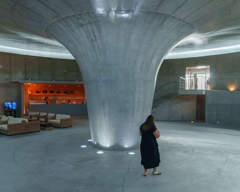 Flared concrete column and daylight inside the underground Capelinhos interpretation centre