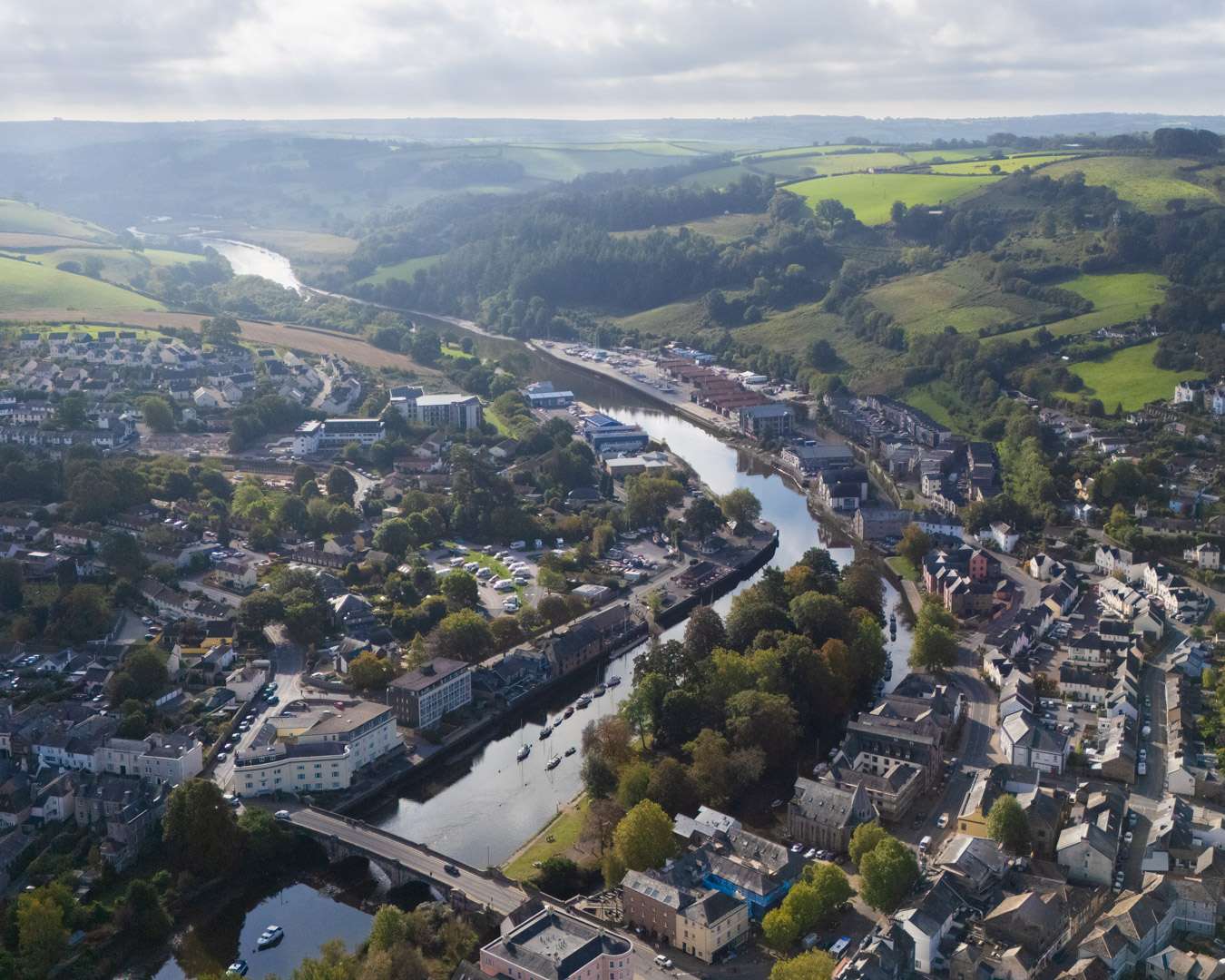 Totnes from the air, the River Dart winding through the town and the hills of South Devon beyond