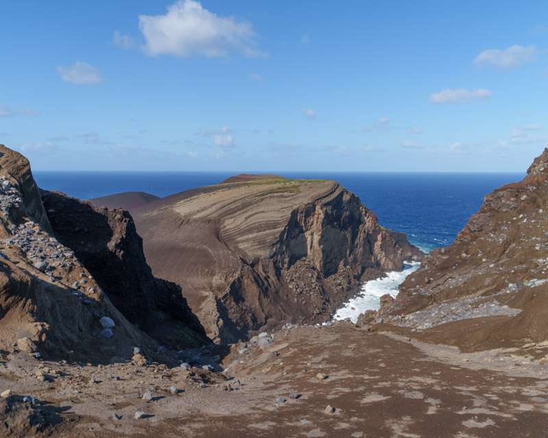 Eroded ash ridges and lava cliffs at Capelinhos above the open Atlantic, Faial