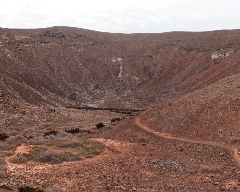 Crater of a Bayuyo volcano with a footpath running round its rim, northern Fuerteventura