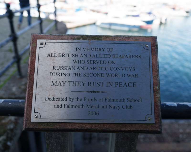 Memorial plaque to British and Allied seafarers of the Russian and Arctic convoys on a quayside railing in Falmouth