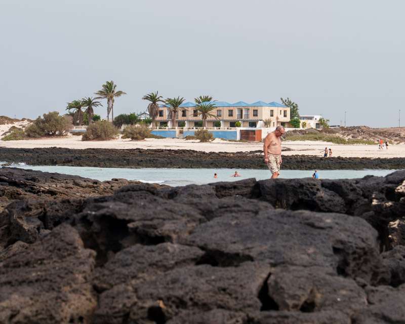 Shallow lagoon behind a lava reef at El Cotillo at low water, northern Fuerteventura