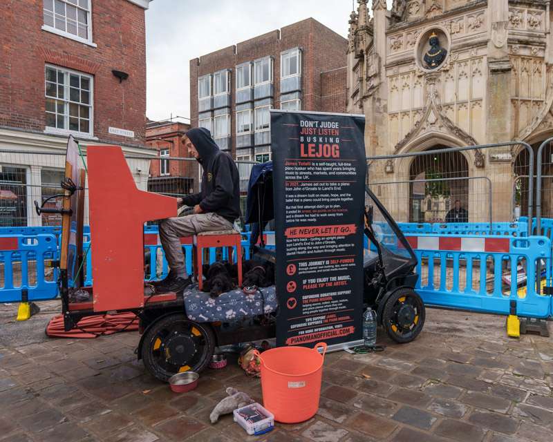 Barriers and a works vehicle beside the Market Cross in Chichester