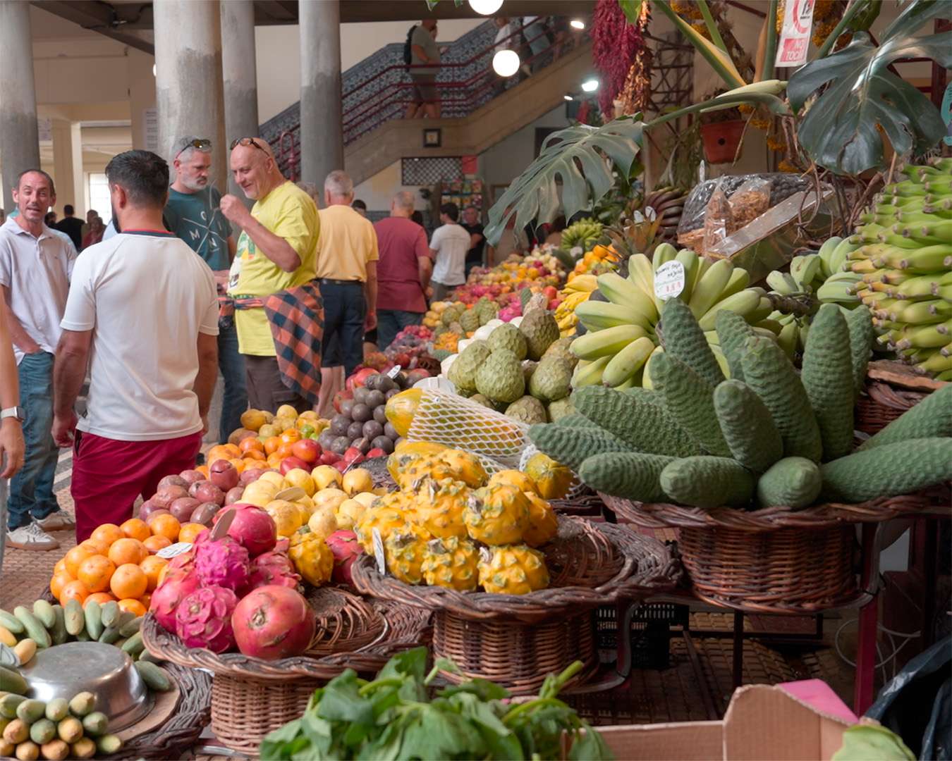 Fruit stalls in the Mercado dos Lavradores with bananas, custard apples and prickly pears