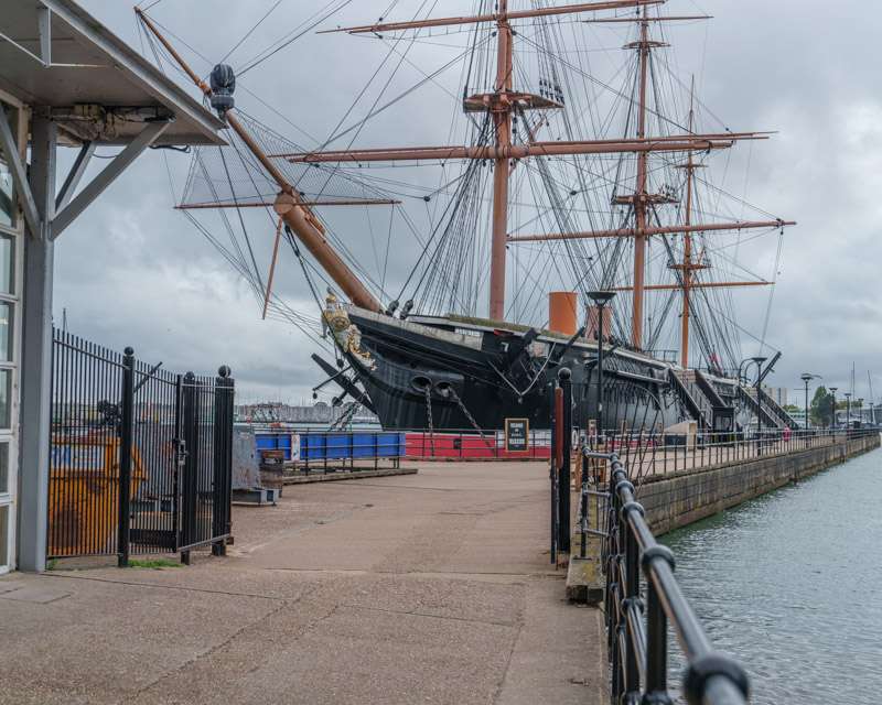 HMS Warrior seen from the quayside inside Portsmouth Historic Dockyard
