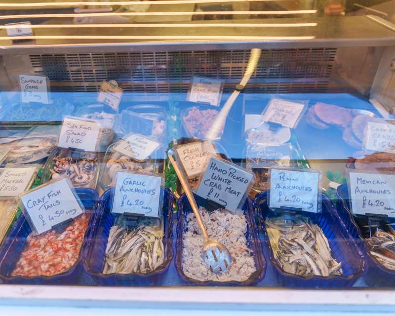 Chilled display of fresh fish and shellfish in a Falmouth fishmonger's window