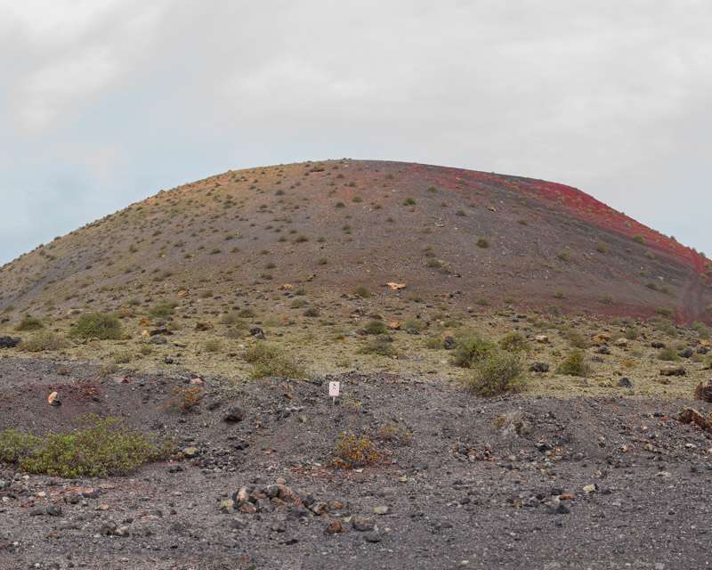 The cone of Montaña Colorada with low scrub on its slopes, Lanzarote