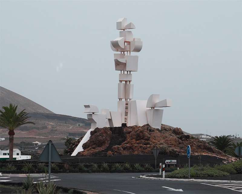 White César Manrique sculpture on lava rock at a roundabout on Lanzarote