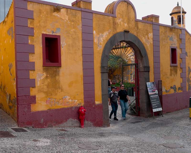 Ochre gateway of Forte de Sao Tiago at the seaward edge of Funchal's old town
