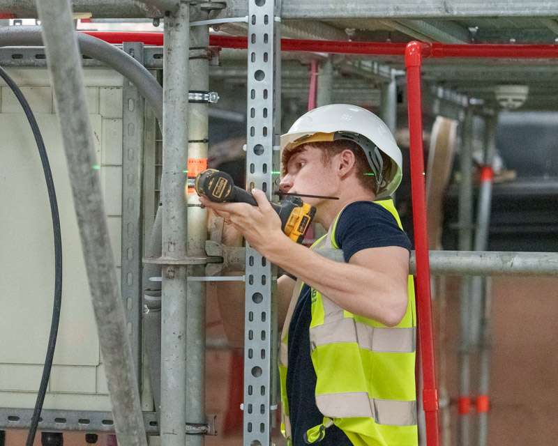 Scaffolder at work on the structure around HMS Victory, Portsmouth Historic Dockyard