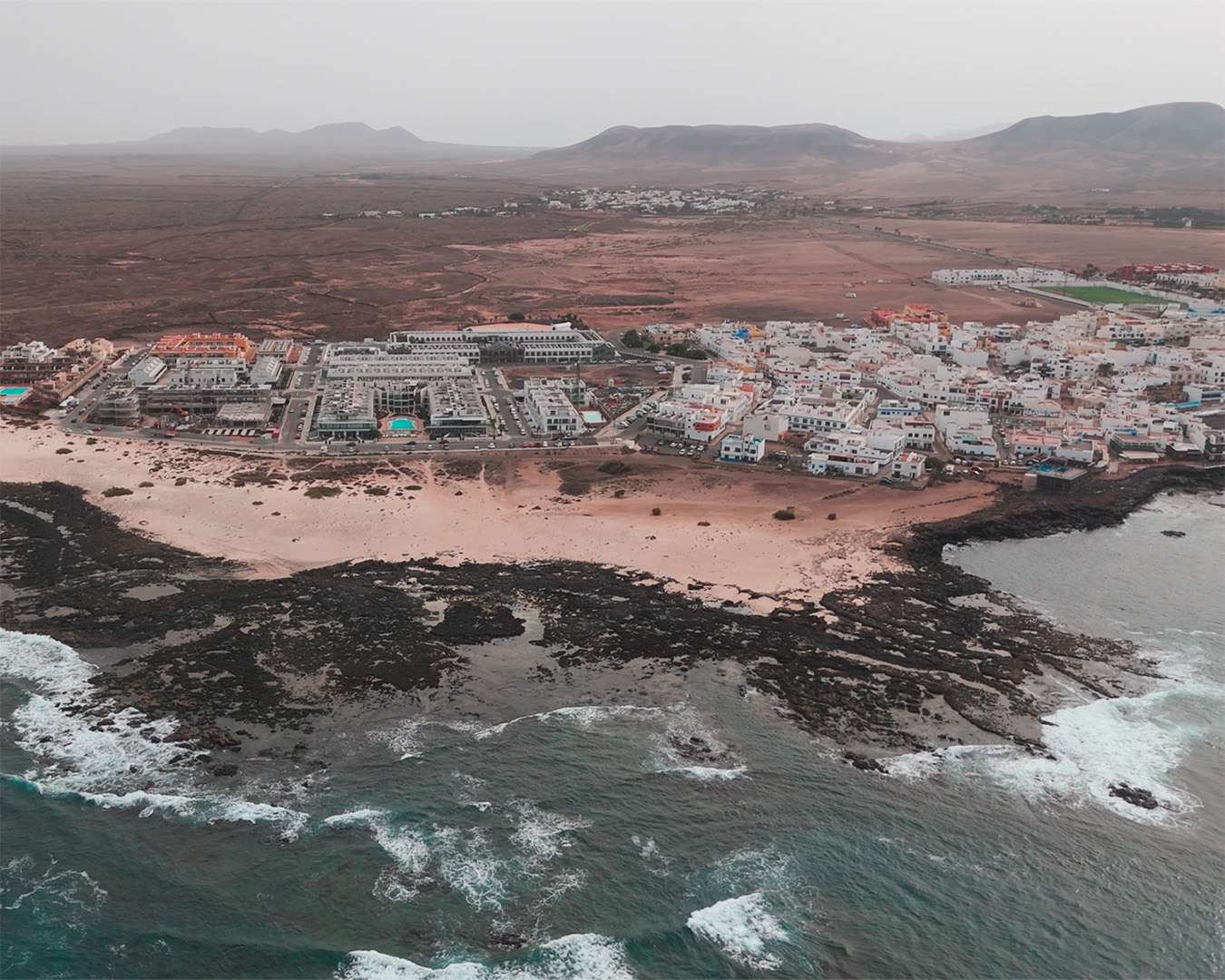 El Cotillo seen from the air with the beach and the black reef, Fuerteventura