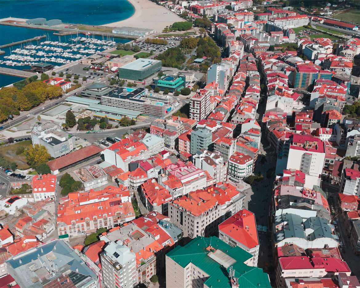 Aerial view over the centre of Vilagarcía de Arousa towards the marina and the town beach