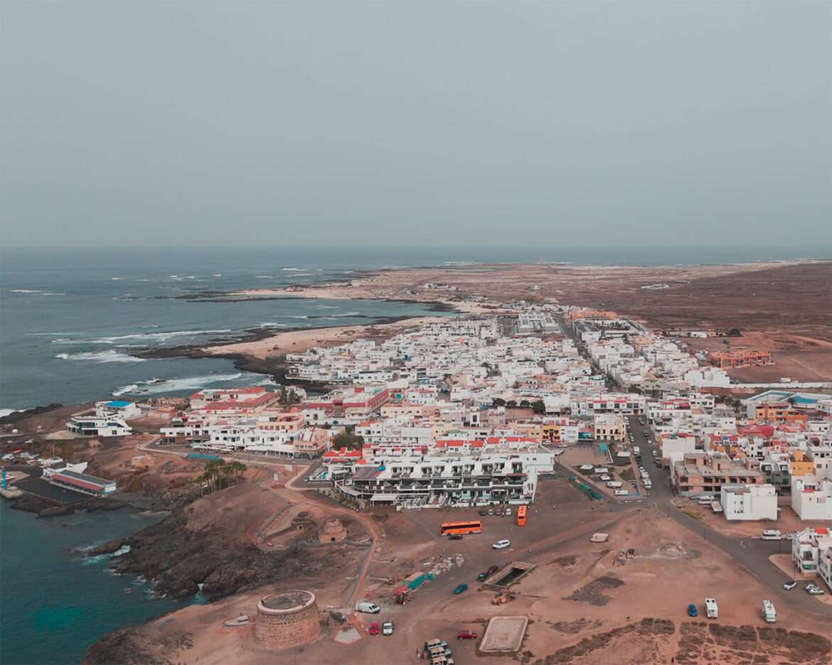 El Cotillo from the air, white houses above the turquoise lagoons and the black reef, Fuerteventura