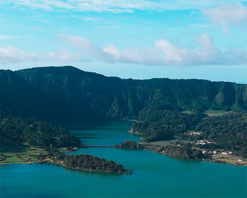 Blue and green lakes of Sete Cidades with the causeway between them, São Miguel