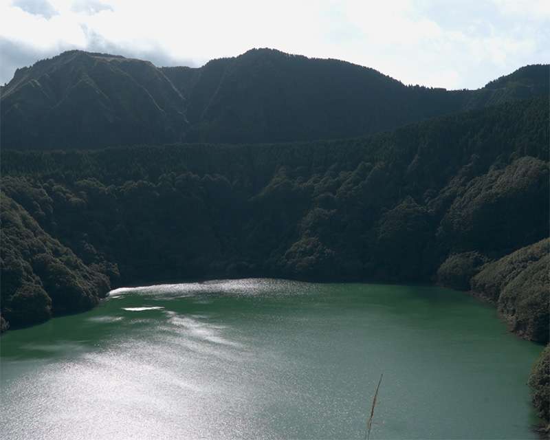 Lagoa de Santiago, a small crater lake in steep wooded walls above Sete Cidades